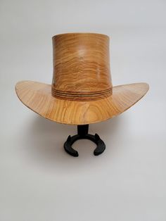 Beautiful wood-turned hat made from Maple. The knot in the front of the hat gives this piece even more character! Make a fashion statement in this unique hat! Measurements: Inside circumference: 22 inches Bill: 17" x 15" Height: 6.5" Weight: 3 lbs. ﻿Hatband and stand available for purchase separately. Wooden Hats, Willow Oak, Wood Hat, Unique Hats, Hat Band, Cowboy Hat, Hat Making, The Knot, Wood Projects