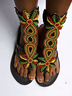 African beaded gladiator shoe Very beautiful and unique too Fully handmade Rasta sandals Traditional Multicolor Ankle Strap Sandals, Beaded Closed Toe Sandals For Festivals, Black Beaded Bohemian Sandals, Black Bohemian Beaded Sandals, Bohemian T-strap Closed Toe Sandals For Festivals, Bohemian Closed Toe T-strap Sandals For Festivals, Traditional Ankle Strap Sandals For Festival, Handmade Traditional Ankle Strap Sandals, Traditional Handmade Ankle Strap Sandals