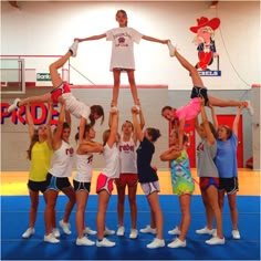 a group of people standing on top of each other in front of a camera screen