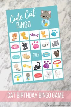 a cat birthday bingo game on a marble table with the words, cute cat bingo