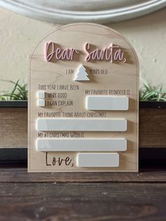 a wooden sign that says dear santa on it with the words i am sorry to you