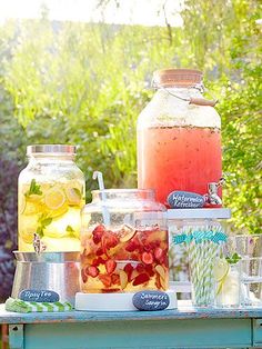 a table topped with jars filled with drinks