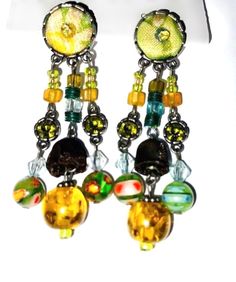 Unique Shop  Colourful vintage earrings Embroidery beads   Dangle earrings  Statement earrings * * Unique styles * * Personalized gift option available. Click on shop, to shop for related products. Shop Now. Click on link for more options: https://www.etsy.com/uk/shop/Africanswagshop?ref=seller-platform-mcnav . #BLACK FRIDAY SALE Retro Beaded Dangle Jewelry, Nickel-free Vintage Drop Beaded Earrings, Vintage Nickel-free Drop Beaded Earrings, Vintage Metal Chandelier Earrings With Dangling Beads, Vintage Beaded Earrings With Dangling Round Beads, Colorful Vintage Beaded Earrings, Vintage Beaded Dangle Earrings, Vintage Colorful Round Beaded Earrings, Vintage Dangle Beaded Earrings