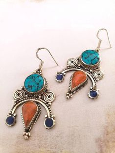 Turquoise and Coral Earrings - Tibetan Style Bohemian Turquoise Jewelry With Artistic Design, Turquoise Bohemian Earrings With Intricate Design, Handmade Turquoise Fusion Earrings, Bohemian Turquoise Earrings With Intricate Design, Traditional Turquoise Metal Earrings, Bohemian Blue Earrings With Artistic Design, Blue Bohemian Earrings With Artistic Design, Unique Turquoise Metal Earrings, Traditional Turquoise Earrings As A Gift