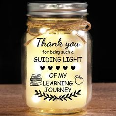 a mason jar filled with glowing lights and some writing on the lid that says, thank you for being such a guiding light of my learning journey