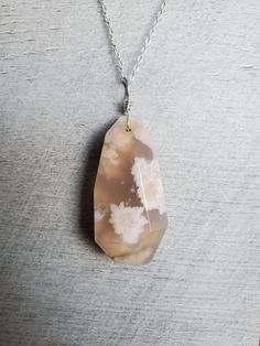 "This unqiue Flower Agate pendant necklace features a piece of free form faceted natural flower agate (also call cherry blossom agate or Sakura agate) with sterlingsilver.  The width of the stones is about 22mm, and the heights is from 27mm shortest to 44mm tallest.  You're going to get the exact one as you choose from options. All-natural flower agate mined from Madagascar, faceted in free form and with smooth shiny high polish, no noticeable holes or cracks in these flower agate pieces. The ju Elegant Agate Necklace With Large Pendant, Unique Agate Pendant Crystal Necklace, Mineral Necklace, Collectible Agate Pendant Jewelry, Untreated Agate Pendant Jewelry, Nature-inspired Agate Necklace With Large Pendant, Agate Pendant Necklace, Cherry Blossom Flowers, Pink Agate