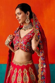 Red attached cancan lehenga featuring multi-colored and gold thread embroidery highlighted with sequin, cutdana and resham. Paired with an embroidered padded blouse and dupatta. - Aza Fashions Red Lehenga With Motifs For Navratri, Red Choli With Motifs For Navratri, Designer Wear Red Choli With Motifs, Red Festive Lehenga With Motifs, Festive Red Lehenga With Motifs, Red Lehenga With Unstitched Blouse For Festivals, Red Choli With Motifs For Diwali, Red Motifs Choli For Reception, Red Diwali Choli With Motifs