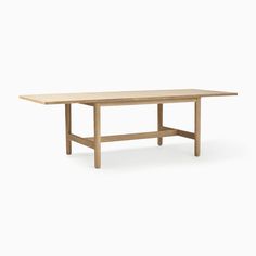 a wooden table with no leaves on the top and one leg extended, in front of a white background