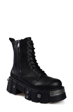 Bring bold biker edginess to your footwear collection with this heavy-duty combat boot set upon a lugged platform sole studded with rivet-style screws, bolts and a numbered plaque. 4" heel; 3 1/2" platform 6" shaft Lace-up style; side zip closure Water resistant Leather upper and lining/rubber sole Imported Platform Combat Boots, Womens Combat Boots, Combat Boot, Footwear Collection, Up Styles, Boot Shoes Women, Side Zip, Combat Boots, Rubber Sole