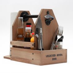 a wooden caddy filled with kitchen utensils