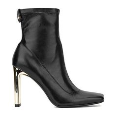 Featuring a fitted shaft, faux leather upper, squared toe and modern metallic block heel, the Chiara boot could not miss this season�s lineup.Closure Type: Pull OnShaft Circumference: 8 InchesBoot Shaft Height: 4 InchesShoe Heel Height: 4 InchesUpper/Outer Base Material: 100% SyntheticShoe Lining Material: TextileSole Material Content: 100% RubberCalf Width: RegularToe Type: Square Toe, Closed ToeHeel Style: Block HeelCountry of Origin: Imported Boots Dress, Dress Boots, Dress And Heels, Boots Black, Dress With Boots, Black Boots, Block Heels, Heel Height, Leather Upper