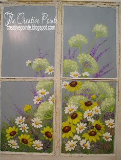 an old window with flowers painted on it