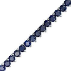 Your look isn’t complete without this eye-catching tennis bracelet. Crafted in sterling silver, this vibrant design sparkles with a row of 4.0mm lab-created bright blue sapphires. Buffed to a brilliant luster, this 7.25-inch bracelet secures with a tongue and groove clasp. Blue Tennis Bracelet With Prong Setting For Formal Occasions, Blue Round Tennis Bracelet With Prong Setting, Blue Tennis Bracelet With Prong Setting, Silver Sapphire Tennis Bracelet With Brilliant Cut, Blue Brilliant Cut Tennis Bracelet For Gift, Blue Brilliant Cut Tennis Bracelet Gift, Sapphire Tennis Bracelet Fine Jewelry With Prong Setting, Sapphire Tennis Bracelet With Jubilee Design, Gift Blue Tennis Bracelet With Prong Setting