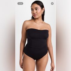 Nwt Good American Sculpt Strapless One Piece A Sleek And Strapless Good American Swimsuit In Jet-Black Fabric, Outfitted With Corset-Style Ties In Back. New With Tag Also Has Plastic Fastener Still Attached As Pictured Medium Coverage Size 0=Xs Princess Seams Strapless Top Lace-Up Back Lined Cups With Removable Padding Wireless Cups Shell: 62% Nylon/38% Elastane Lined Lining: 95% Polyester/5% Elastane Wash Warm Imported Outfit With Corset, American Swimsuit, Strapless One Piece, Orange Swimsuit, Princess Seams, One Piece Swim, Corset Style, Fitted Skirt, Good American