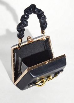 This Chain Decor Eco Leather Mini Square Bag is a stylish and environmentally-friendly accessory that is perfect for any occasion. Made of high-quality eco leather, this bag features a chic chain decoration and comes in a sleek black color. Add a touch of sophistication to your outfit while also supporting sustainability. Material: Polyurethane Leather Shoulder Bag With Gold Chain For Party, Chic Handheld Evening Bag With Chain, Elegant Office Bags With Chain Detail, Elegant Office Bag With Chain Detail, Chic Handheld Bag With Chain Detail, Chic Handheld Bag With Chain, Chic Leather Box Bag With Chain Strap, Elegant Top Handle Bag With Chain, Square Box Bag With Chain For Evening