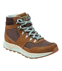 a women's hiking shoe with blue laces on the side and brown upper part