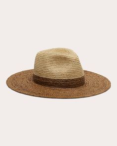 Skillfully crafted from woven raffia, the Emmanuelle fedora displays neutral color blocked hues. The wider brim and indented crown give nod to traditional styles. Indented crown Woven 100% raffia Spot clean Made in China Measurements Crown height: 6in Brim: 4in Sustainability Metrics: Circular Economy: product is intentionally designed with 50% of actively cycled materials Clean Ingredients: 100% of materials used are natural ingredients and free of any synthetic additives Organic Materials: at least 60% of materials used for production come from natural sources and do not contain harmful toxins or waste Craft & Community: at least 75% of products are fully sourced and manufactured within the specified community or country; 100% of production adheres to a fair wage system Animal Welfare: p Traditional Styles, Animal Fur, Woven Raffia, Eugenia Kim, Circular Economy, Organic Materials, Clean Ingredients, Animal Welfare, Neutral Color