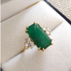 Free express shipping and customs fees to the United States Crafted from 18K solid gold, this octagon-cut emerald ring features brilliant diamonds, exuding timeless elegance. A perfect luxury engagement or bridal gift, it symbolizes lasting love with its unique green gemstone. Ideal for special moments Gemstone: Emerald Quantity: 1 Dimensions: 0.52 in x 0.28 in x 0.13 in Total Carat Weight: 2.99 carats Diamond Cut: Round Brilliant Quantity: 4 Dimensions: Diameter of 0.10 in each Total Carat Weig Emerald Green Ring, Luxury Gifts For Her, Emerald Diamond Ring, Engagement Ring Cuts, Green Gemstones, Brilliant Diamond, Emerald Diamond, Emerald Ring, Bridal Gifts