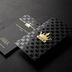 a black and gold business card with a crown on it