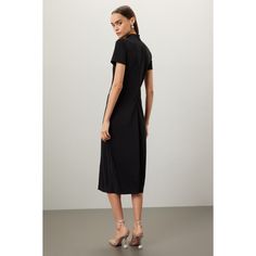 Black jersey (57% Polyester, 38% Recycled Polyester, 5% Polyurethane). A-line. Short sleeves. Turtleneck Back zipper closure. 49" from shoulder to hemline. Imported. A-line Elastane Midi Dress For Party, Black Midi Dress With Side Zipper, Black A-line Midi Dress In Elastane, Black Knee-length Dress With Invisible Zipper, Black Knee-length Dress, Fitted Black Midi Dress With Side Zipper, Evening Knee-length Dress With Invisible Zipper, Knee-length Evening Dresses With Invisible Zipper, Knee-length Midi Dress With Side Zipper For Night Out