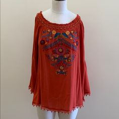 Super Cute On Or Off The Shoulder Embroidered Top. Beautiful Rust Top With Mustard, Real And Burgundy Embroidery. Red Embroidered Top With Embroidered Hem, Summer Embroidered Red Blouse, Red Embroidered Summer Blouse, Red Bohemian Top With Embroidered Hem, Bohemian Red Top With Embroidered Hem, Bohemian Red Tops With Embroidered Hem, Red Folk Tops With Floral Embroidery, Red Embroidered Folk Blouse, Red Tops With Floral Embroidery For Festivals