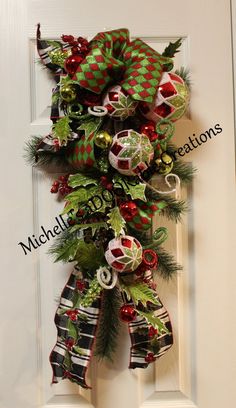 a christmas wreath hanging on the front door