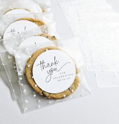 three cookies with thank you stickers on them