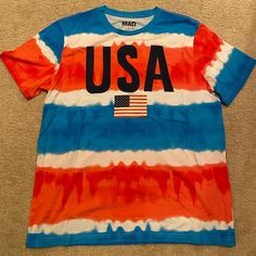 Usa Patriotic Stripe T-Shirt By Mad Engine. Size Xl. In Brand New Condition, Never Worn! Casual Blue Tops With American Flag Print, Casual Blue Tops With Flag Print, Blue American Flag Print Short Sleeve Top, Blue Short Sleeve T-shirt With American Flag Print, Blue Patriotic T-shirt With American Flag Print, Casual Multicolor T-shirt For 4th Of July, Blue Short Sleeve Top With American Flag Print, Multicolor Short Sleeve Shirt For 4th Of July, Multicolor Cotton T-shirt For 4th Of July