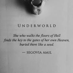 a piece of paper with a quote on it that reads, underworld she who walks the floors of hell finds the key to the gates of her own heaven, buried there like a seed