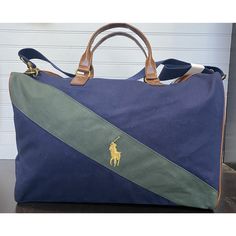 Polo Ralph Lauren Navy Blue Green Stripe Soft Shell Duffle Bag. - -Condition Is New. Strapped Still Wrapped - -Ships Usps Polobag Poloralphlaurenduffle Dufflebag Poloduffle Backtoschool Navy Shoulder Bag With Dust Bag For Travel, Blue Rectangular Duffle Bag With Luggage Sleeve, Rectangular Blue Duffle Bag With Luggage Sleeve, Blue Tote Bags With Leather Trim, Blue Rectangular Shoulder Bag With Leather Trim, Blue Canvas Shoulder Bag With Leather Trim, Blue Tote Duffle Bag With Luggage Sleeve, Blue Canvas Satchel With Top Carry Handle, Blue Bags With Leather Trim For Daily Use