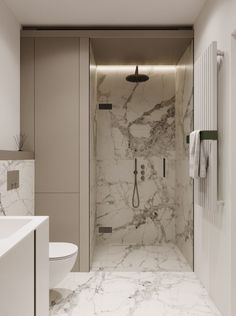 a bathroom with marble floors and walls