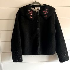 Brand New Jacket Measures 24 Inches Pit To Pit; 23 Inches In Length. Has Pretty Embroidery On Collar And Bottom Of Sleeves. Buttons Down Closure. Great For Upcoming Season. Black Embroidered Winter Outerwear, Black Long Sleeve Outerwear With Floral Embroidery, Black Outerwear With Embroidered Cuffs And Long Sleeves, Black Long Sleeve Outerwear With Embroidered Cuffs, Black Winter Outerwear With Embroidered Cuffs, Fall Collared Outerwear With Floral Embroidery, Embroidered Collared Outerwear For Winter, Winter Outerwear With Floral Embroidery And Long Sleeves, Embroidered Collared Outerwear For Fall