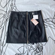 Nwt. Tiger Mist Faux Leather Skirt. Size M. Soft Comfy Leather Black Zip Front Waist: 28" Length: 15" 55% Polyester 45% Polyurethane #A8 Black Leather Skirt With Zipper Closure, Spring Faux Leather Skirt With Zipper Closure, Spring Faux Leather Skirt With Zipper, Faux Leather Mini Skirt With Zipper Closure, Spring Skirt With Zipper Closure For Night Out, Tiger Mist, Faux Leather Skirt, Mist, Leather Skirt