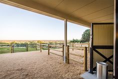 an outdoor area with horse pens and fenced in areas