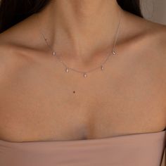 Need an elegant and sophisticated jewelry piece to elevate your ensemble? Our marquise diamond necklace takes your look to the next level with its dainty chain and delicate teardrop diamond charms. Material: High Quality Solid 925 Sterling Silver Finish: Sterling Silver ∙ 18K Gold Featuring five 2mm x 5mm Marquise CZ Diamonds spaced ~3cm apart, on an adjustable 16 to 18 inch chain. Model is wearing the 17 inch length SKU: RR-NR091 Caitlyn Minimalist, Marquise Diamond Necklace, Teardrop Diamond, Sophisticated Jewelry, Dainty Chain, Diamond Charm, Station Necklace, Marquise Diamond, Crystal Charm