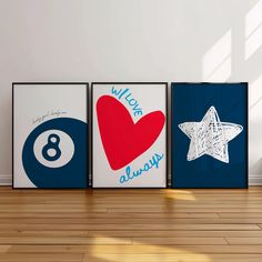 three framed art pieces on the wall in an empty room with hard wood flooring