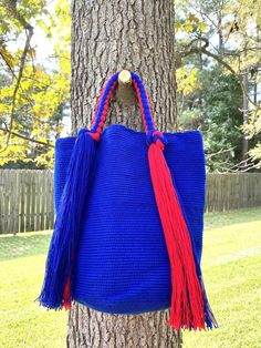 These beautiful, one-of-a-kind, 100% handmade top handle bag has been carefully crocheted by women from the Wayuu tribe in La Guajira, Colombia.This beautiful Wayuu braided bag is carefully crafted using a double thread technique for the body. Approximate dimensions:Height: 11-12 inchesWidth: 13 inchesDepth: 4 inchesEach piece represents approximately 1 week of work for a single artisan.**Listing is for 1 Wayuu bag only.**Please choose color in the drop down options. Large Handmade Everyday Shoulder Bag, Blue Crochet Bag With Top Handle For Everyday Use, Blue Handwoven Top Handle Bag, Large Handmade Shoulder Bag For Shopping, Large Handmade Beach Bag For Shopping, Handmade Top Handle Bucket Bag For Travel, Handmade Blue Bucket Bag For Everyday Use, Large Handmade Shoulder Bag For Everyday, Large Everyday Handmade Bags