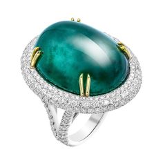 GIA Certified 50.6ct Oval Emerald Cabochon Diamond Cocktail Ring GIA#6173253976 Exceptional GIA certified Green Emerald with diamond accents set and mounted in 18k White gold. The stone is a real gem, rare to find in this color , the deep green color of emerald is unique and timeless. It measures 26.27-20.67x13.91 mm- delivers a huge look, totaling 50.60ct. The oval cabochon cut is gorgeous and truly a royal stone - emerald is bright and stands out from far away. It is natural with some inclusio Emerald Cabochon, Natural Emerald Rings, Pink Diamonds, Diamond Cocktail Ring, Emerald Diamond Ring, Diamond Cocktail Rings, Gold Engraving, Cabochon Ring, Modern Ring