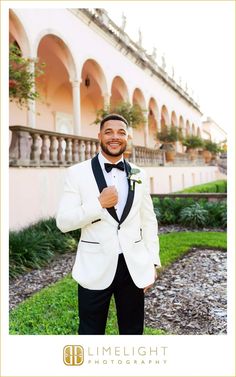 a man in a tuxedo poses for a photo