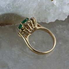 Vintage 14K Yellow Gold Oval Emerald and Diamond Halo Ring, 1.53ct emerald set high 5/16 inches on ring, basket setting, oval emerald 1.53 ct, 9x7mm, .56 ct round diamonds halo (16 total), .5 inches across, Ring size 4.75, Circa 1960, 4 grams. Stock # BB256R04 Most rings are sizable for a small fee. If the ring you are considering is the incorrect size contact us for a quote. This listing contains photographs of the actual item you will receive. Our items are in excellent condition with little o Gold Oval Emerald Ring For Formal Occasions, Formal Gold Emerald Oval Ring, Oval Emerald Ring Stamped 14k, Oval Emerald Ring Stamped 14k Gold, Classic Oval Emerald Ring Stamped 14k, Oval Gold Emerald Ring With Halo Setting, Oval Emerald Ring In Yellow Gold With Halo Setting, Formal Oval Emerald Ring Stamped 14k, Formal Oval 14k Stamped Emerald Ring