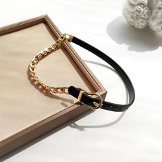 ✦ Elevate your style with our Asymmetric Cool Leather Half Chain Choker Necklace. This striking piece features a unique combination of half bold curb chain and half belt leather chain, creating a cool and stylish look. Perfect for any occasion, from a fancy dinner to a casual day out. Available in brown and black for a touch of cowboy charm. ----------- DETAILS ------------ Size (Length*Width):41cm include chain Width 0.9cm- Color: Black/ Brown- Materials: Alloy, Leather- SKU: HN940 Buckle Necklace, Bar Pendant Necklace, Basic Jewelry, Crystal Hoop Earrings, Belt Leather, Fancy Dinner, Black Choker, Chain Choker Necklace, Choker Collar