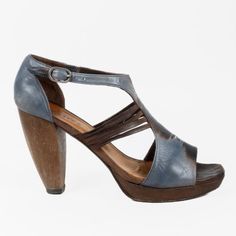 Crafted From Leather, These Coclico Sandals Feature An Abstract Blue Upper With Cut-Outs On The Sides, A Square Toe, An Adjustable Ankle Strap, And A Sculptural Wooden Heel. Size: 39 Condition: Fair; Visible Wear On Outsole, Visible Residue On The Insole, No Inclusions Approximate Measurements: Insole Length: 10” (25 Cm) Heel Height: 4” (10 Cm) Composition: Leather, Wood Wood Heel, Blue Wood, Wooden Heel, Heel Sandals, Cut Outs, Women's Shoes Sandals, Ankle Strap, Sandals Heels, Shoes Sandals