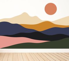 a wall mural with mountains and the sun in the sky above it on a wooden floor