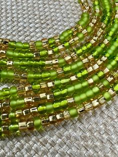 Description One 50 inch tie-on luxury waist bead Created on a durable Ghanian string A blend of green and gold seed beads Gold Waist Beads, Body Beads, Sage Green And Gold, Waist Beads, Crystal Collection, Green And Gold, Sage Green, Seed Beads, Product Description