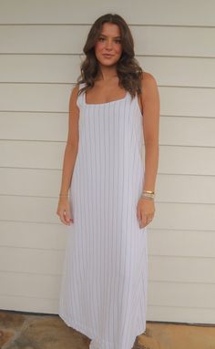 The perfect, casual dress for summer! The Never Better Dress is a lightweight linen blend maxi dress in a shift silhouette. It features a soft square neckline and wide straps - all in a white fabric with pinstripes. Rosalind is 5'8" and is wearing size small size small measurements: 34" bust | 53" length 60% polyester | 40% linen PRODUCTS ON SALE ARE FINAL SALE! Feel free to email us at orders@shopriffraff.com or DM us with any questions regarding fit, styling, or our return policy in general. Casual Maxi Dress With Straight Neckline, Summer Maxi Dress With Straight Neckline For Daywear, Beach White Maxi Dress With Vertical Stripes, White Vertical Stripes Dress For Daywear, Casual Square Neck Maxi Dress For Daywear, White Maxi Dress With Straight Neckline For Day Out, Casual Maxi Dress With Square Neck For Daywear, Summer Maxi Dress With Straight Neckline, Summer Maxi Dress With Vertical Stripes