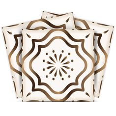 set of four brown and white square plates with decorative designs on the front, back and sides