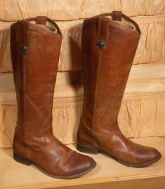 "Hey there horse and country lover: Here's some tall boots you'll love wearing to ride horses. These are vintage Frye leather boots from the 1990's and they are in really great pre-loved condition with normal signs of wear/scuff and sole use but no major damage or smells. They have a nice and smooth brown leather material in a size 6B with the collectible FRYE stamp and label on the interior. They have stacked short wooden heels and exterior pull-on straps. You'll love these everyday boots every Vintage Wide Calf Knee-high Boots For Fall, Vintage Round Toe Boots For Ranch, Vintage Brown Knee-high Moto Boots, Vintage Moto Boots For Western-themed Fall Events, Vintage Brown Moto Boots For Fall, Vintage Leather Riding Boots, Vintage Riding Boots For Fall, Vintage Wide Calf Knee-high Boots, Vintage Moto Boots With Round Toe For Western-themed Events