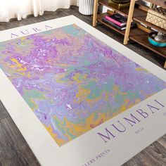 a large rug with the word mumbal on it in purple, yellow and blue