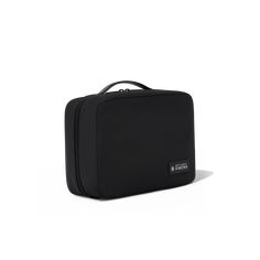 Crafted out of resilent, water-repellent, and recycled nylon, the RIMOWA Toiletry Pouch Trifold is made of lightweight materials and comes in a sleek shade of Matte Black. Designed to keep your items organised, the trifold pouch is the ideal bag for storing and carrying all your essential toiletries and cosmetics during travel. It features a range of smart functionalities: - A bespoke hanger hook to allow for easy access to items - Grey lined roomy interior sized at 70 x 26,5 x 4,5 cm once opened, featuring functional pockets - A zipped flat pouch with flat pockets to store small items - A zipped pouch to store bigger items equipped with mesh pockets for clear visibility of smaller items - A zipped and removable transparent pouch designed to store liquid toiletries Black Rimowa, Transparent Pouch, Flat Pouch, Luggage Organization, Toiletry Pouch, Design Essentials, Vanity Case, Business Bag, Garment Bags