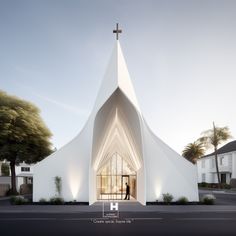 a white church with a person standing in the doorway